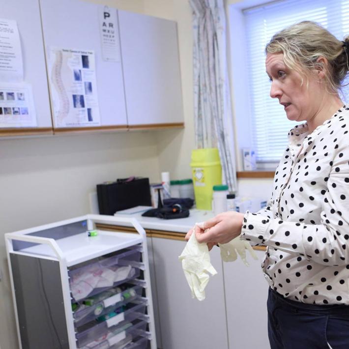 Female GP in surgery