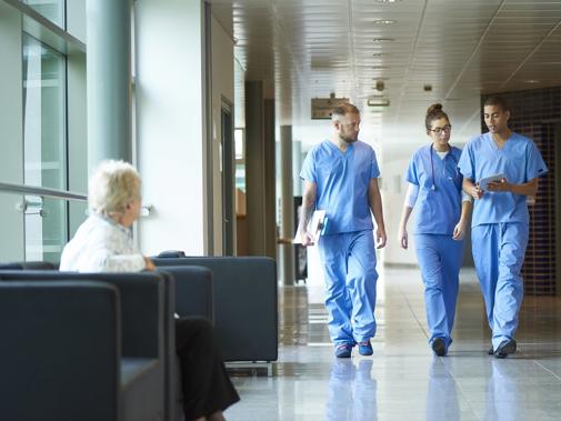 Group of trainee doctors in corridor