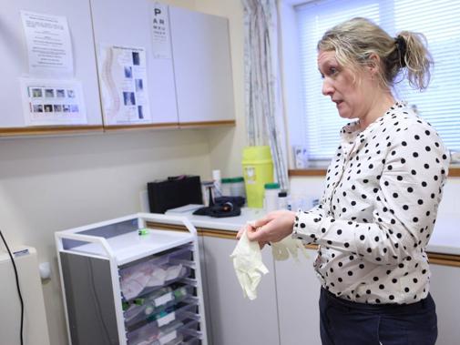 Female GP in surgery